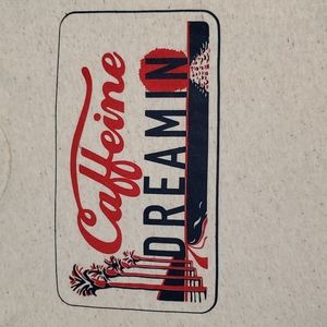 Caffeine Dreamin' graphic tee beachy license plate frame Small